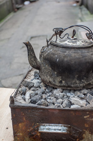Domestic coal-burning stoves as bad gas emitters as wood-fired ones